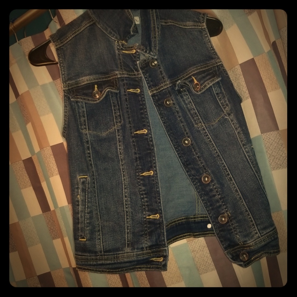 A no sleeve Jean jacket